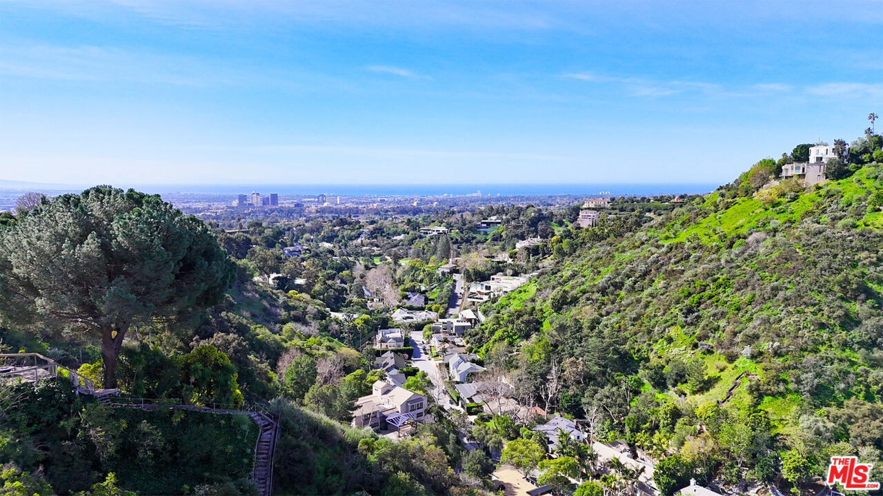 1001 Stradella Road Los Angeles, CA 90077 - Photo 2 of 28 a view of a city and mountains in the background