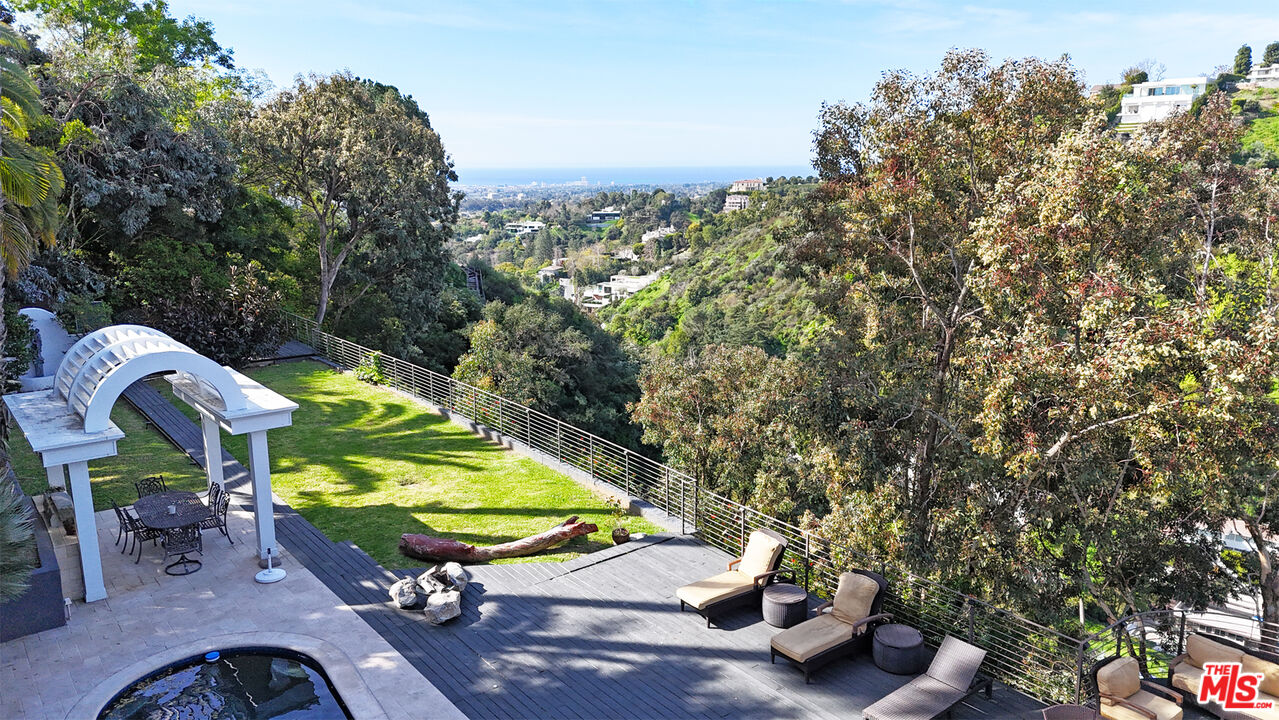 1001 Stradella Road Los Angeles, CA 90077 - Photo 27 of 28 a view of a park with iron fence