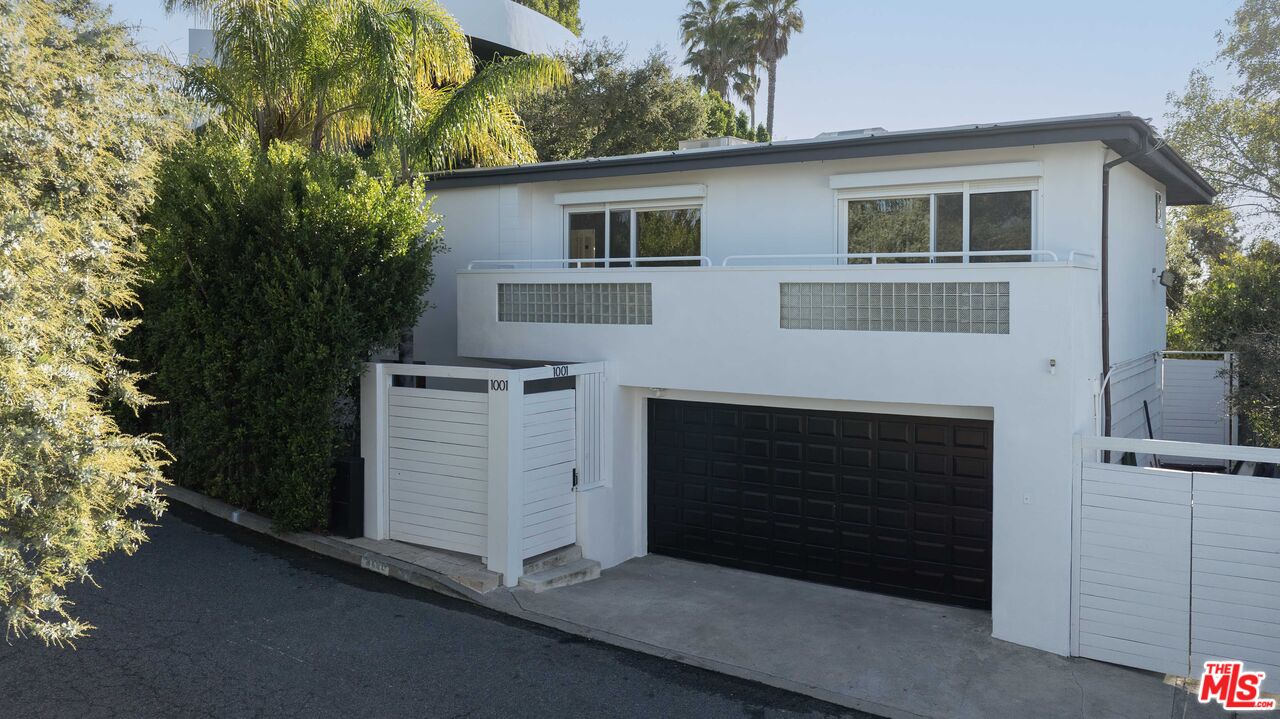 1001 Stradella Road Los Angeles, CA 90077 - Photo 28 of 28 a front view of a house with a yard