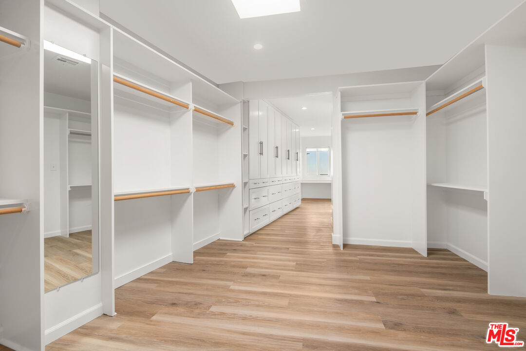 1001 Stradella Road Los Angeles, CA 90077 - Photo 10 of 28 a view of empty room with wooden floor