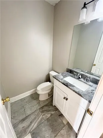 a bathroom with a tub sink and a mirror