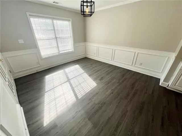 a view of a house with snow on the road