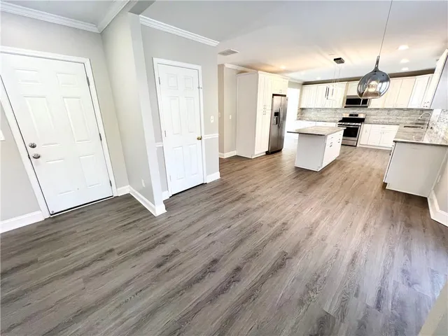 a spacious bathroom with a bathtub and a shower