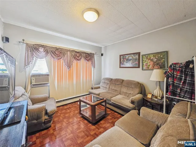 a living room with furniture and a window