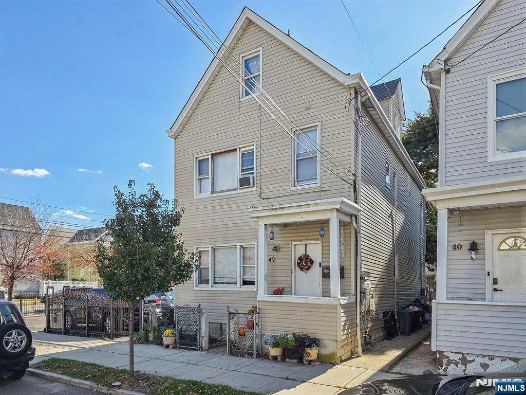 42 Grand Street Garfield, NJ 07026 - Photo 4 of 26 a view of a house with a yard