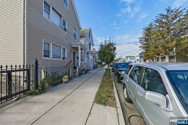 a view of multiple houses with yard
