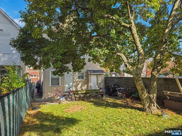 a view of a house with backyard porch and sitting area
