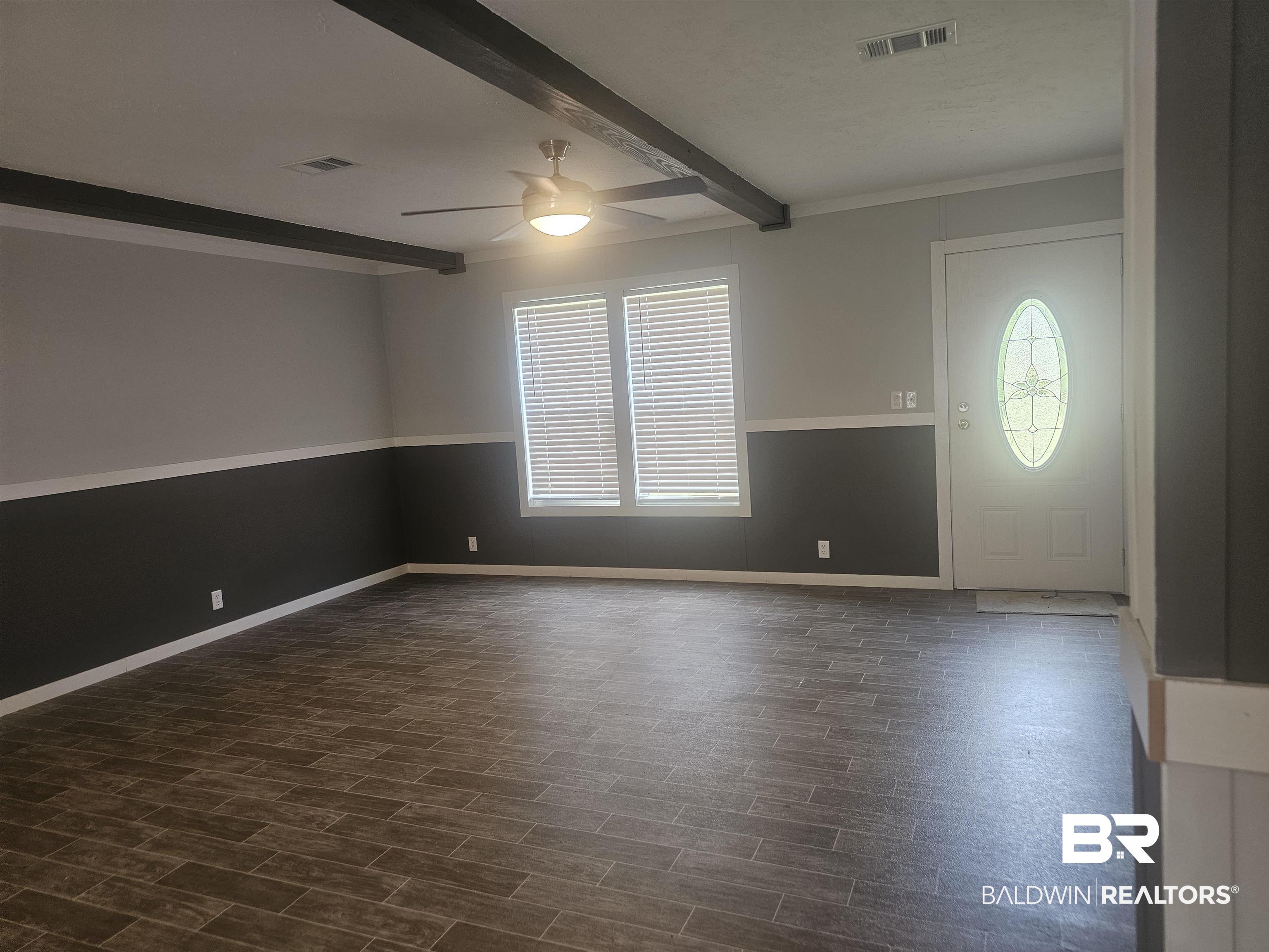 1863 Wait Road Monroeville, AL 36460 - Photo 33 of 38 Entryway featuring ceiling fan, beamed ceiling, crown molding, and dark hardwood / wood-style flooring
