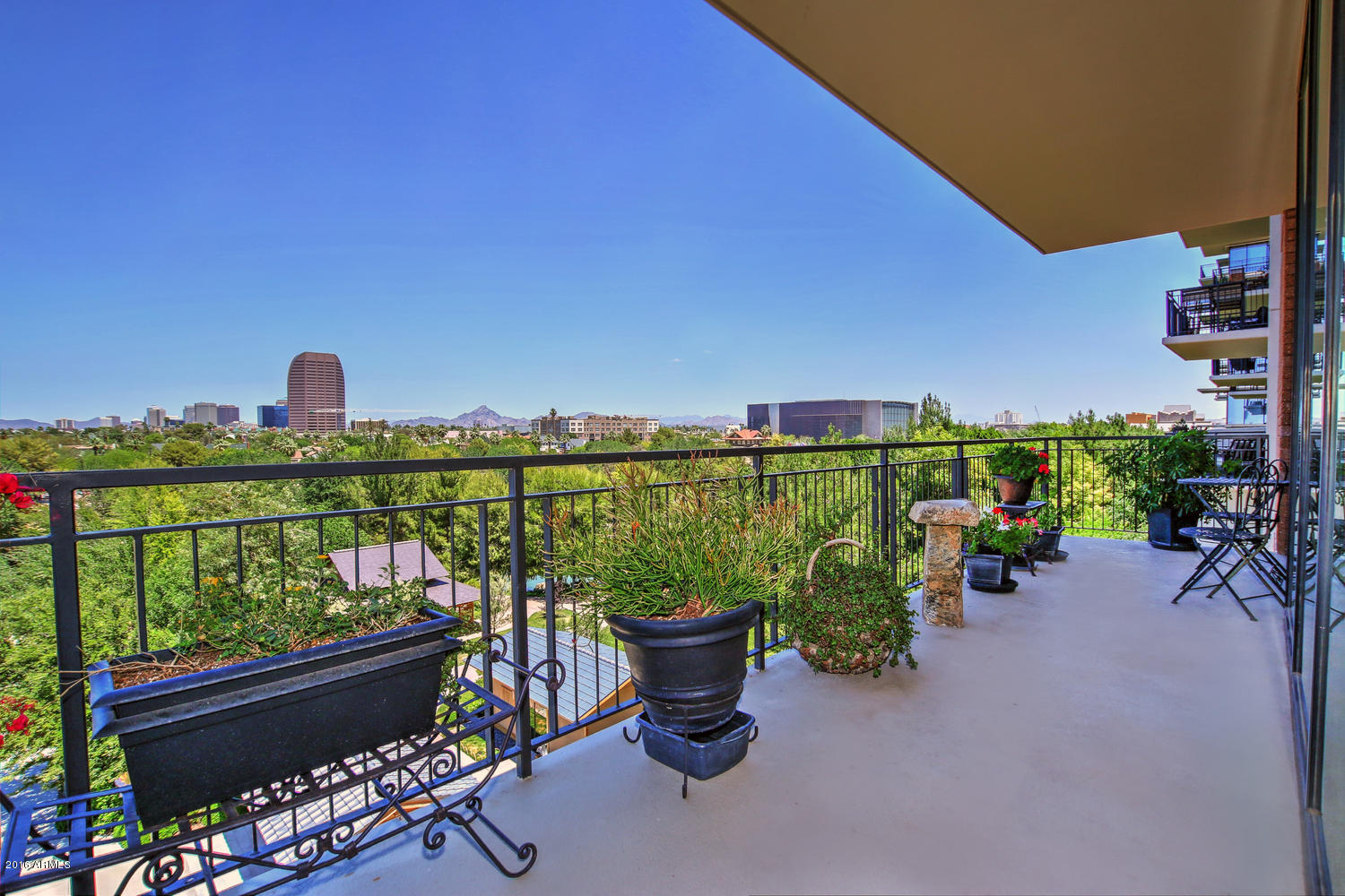 208 West Portland Street, Unit 460 Phoenix, AZ 85003 - Photo 13 of 37 a city view from a balcony with outdoor seating