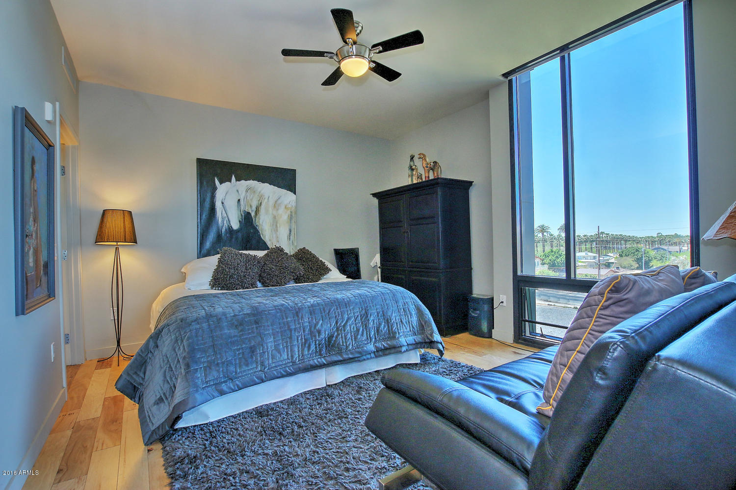208 West Portland Street, Unit 460 Phoenix, AZ 85003 - Photo 20 of 37 a bedroom with furniture and wooden floor