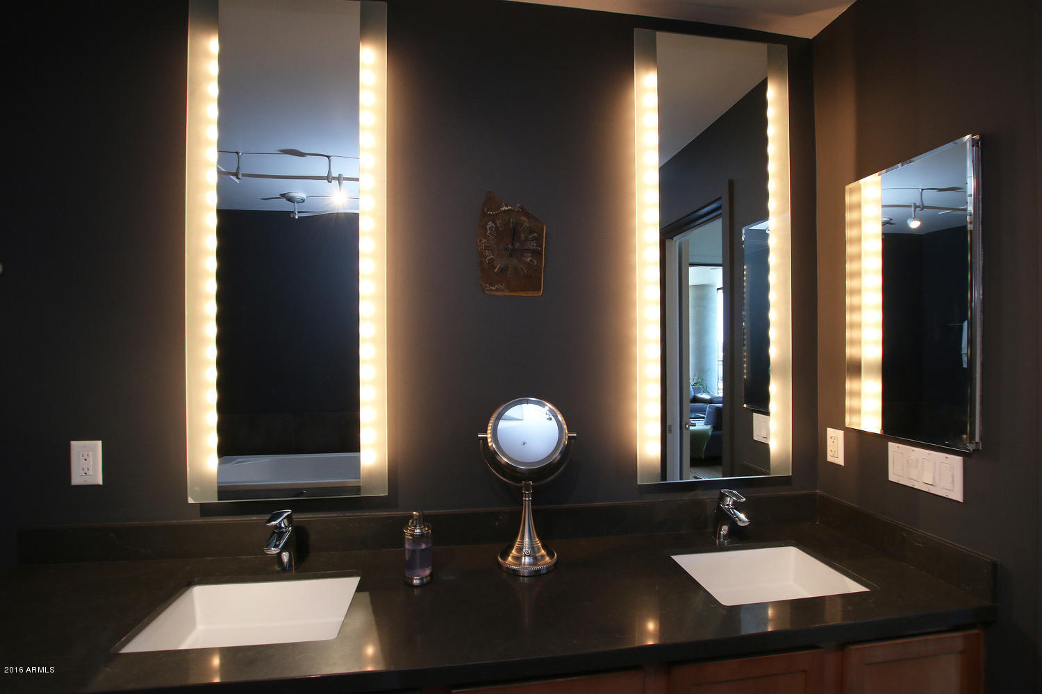 208 West Portland Street, Unit 460 Phoenix, AZ 85003 - Photo 24 of 37 a bathroom with a sink and a mirror