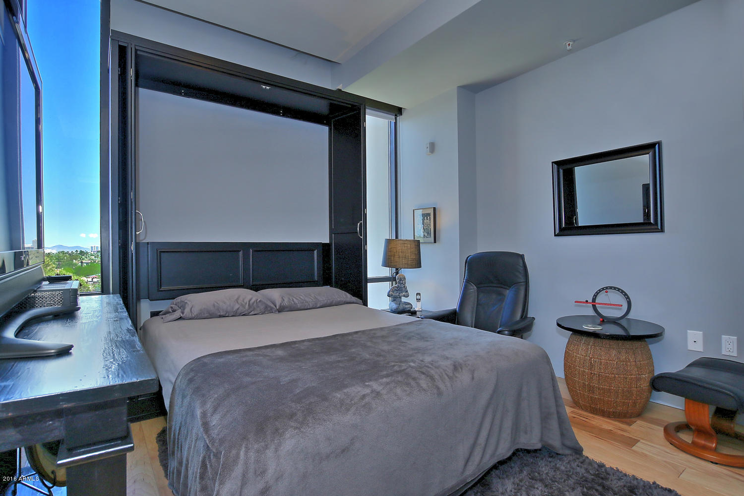 208 West Portland Street, Unit 460 Phoenix, AZ 85003 - Photo 27 of 37 a bedroom with a bed and a desk