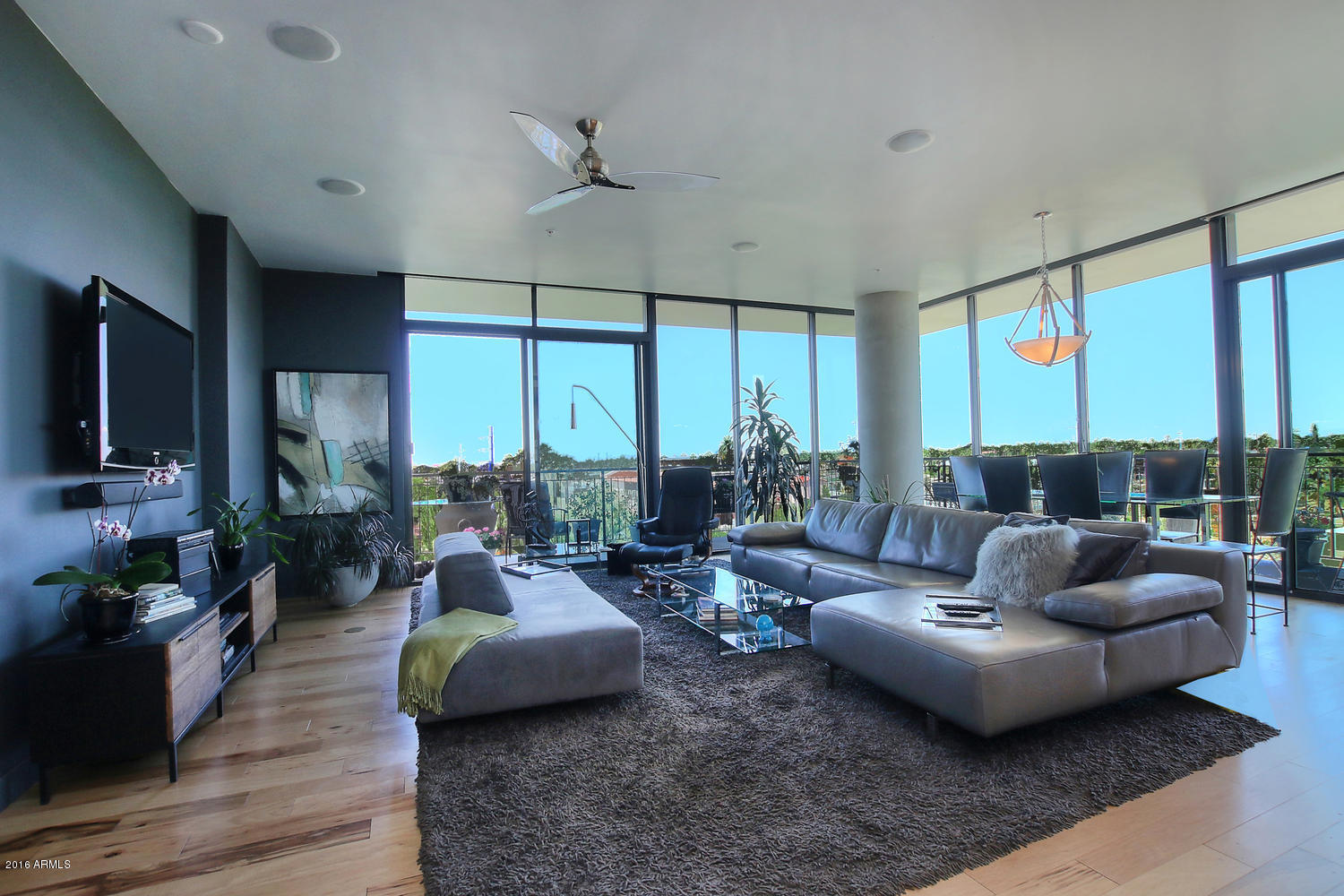 208 West Portland Street, Unit 460 Phoenix, AZ 85003 - Photo 4 of 37 a living room with fireplace furniture and a large window