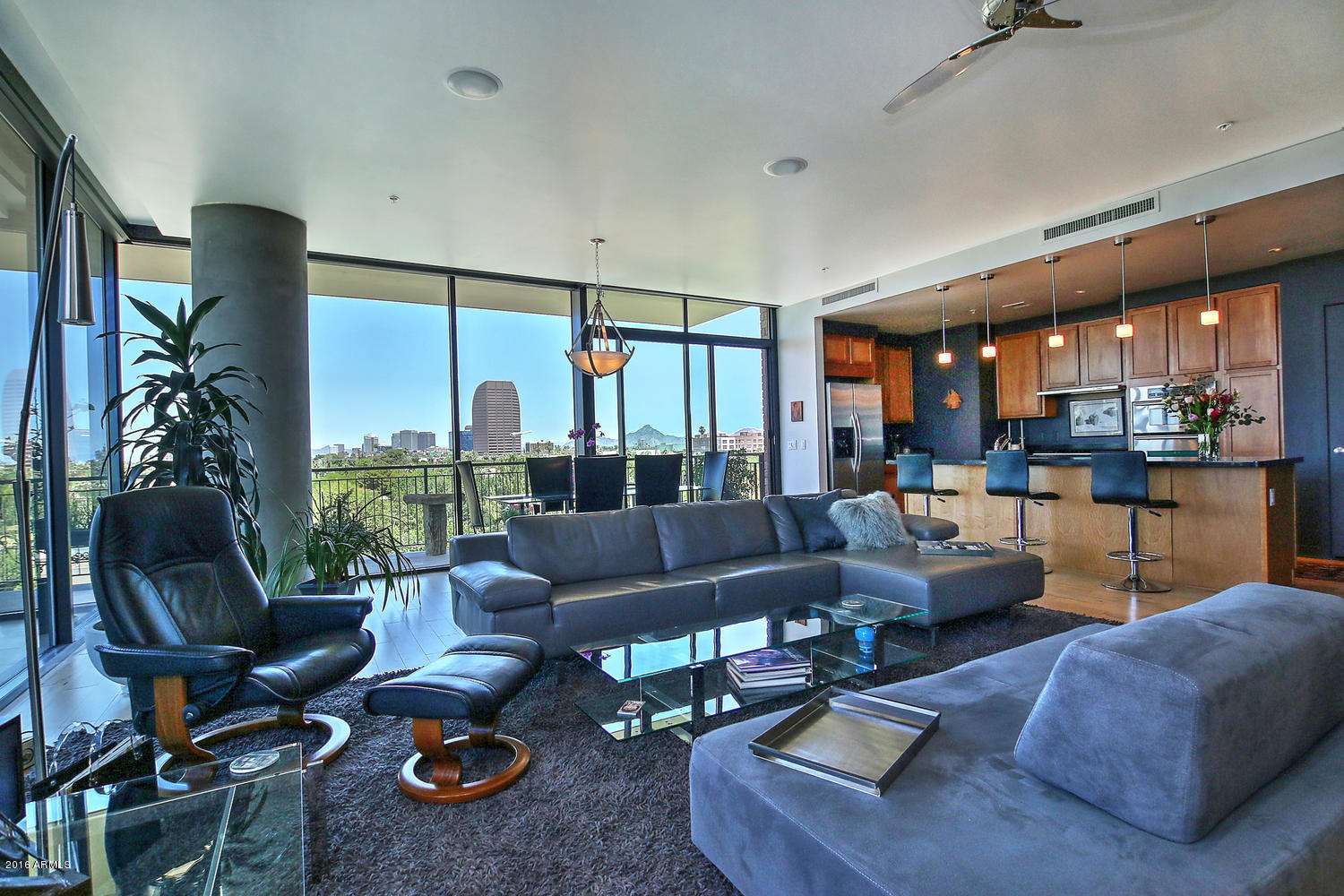 208 West Portland Street, Unit 460 Phoenix, AZ 85003 - Photo 5 of 37 a living room with furniture and a large window