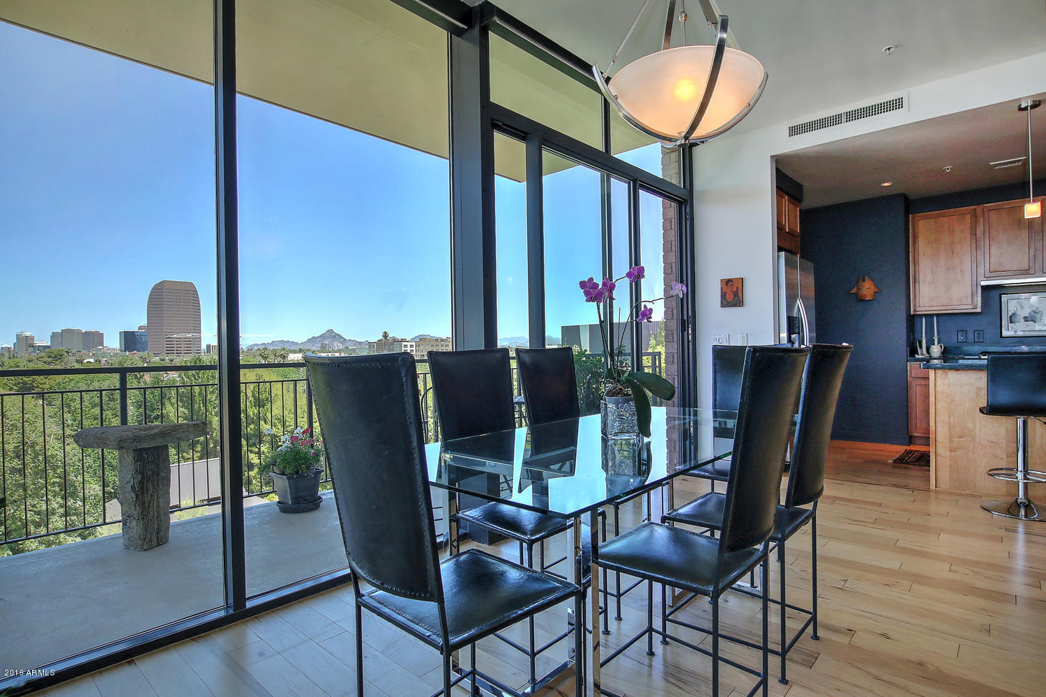 208 West Portland Street, Unit 460 Phoenix, AZ 85003 - Photo 9 of 37 a dining room with furniture and wooden floor