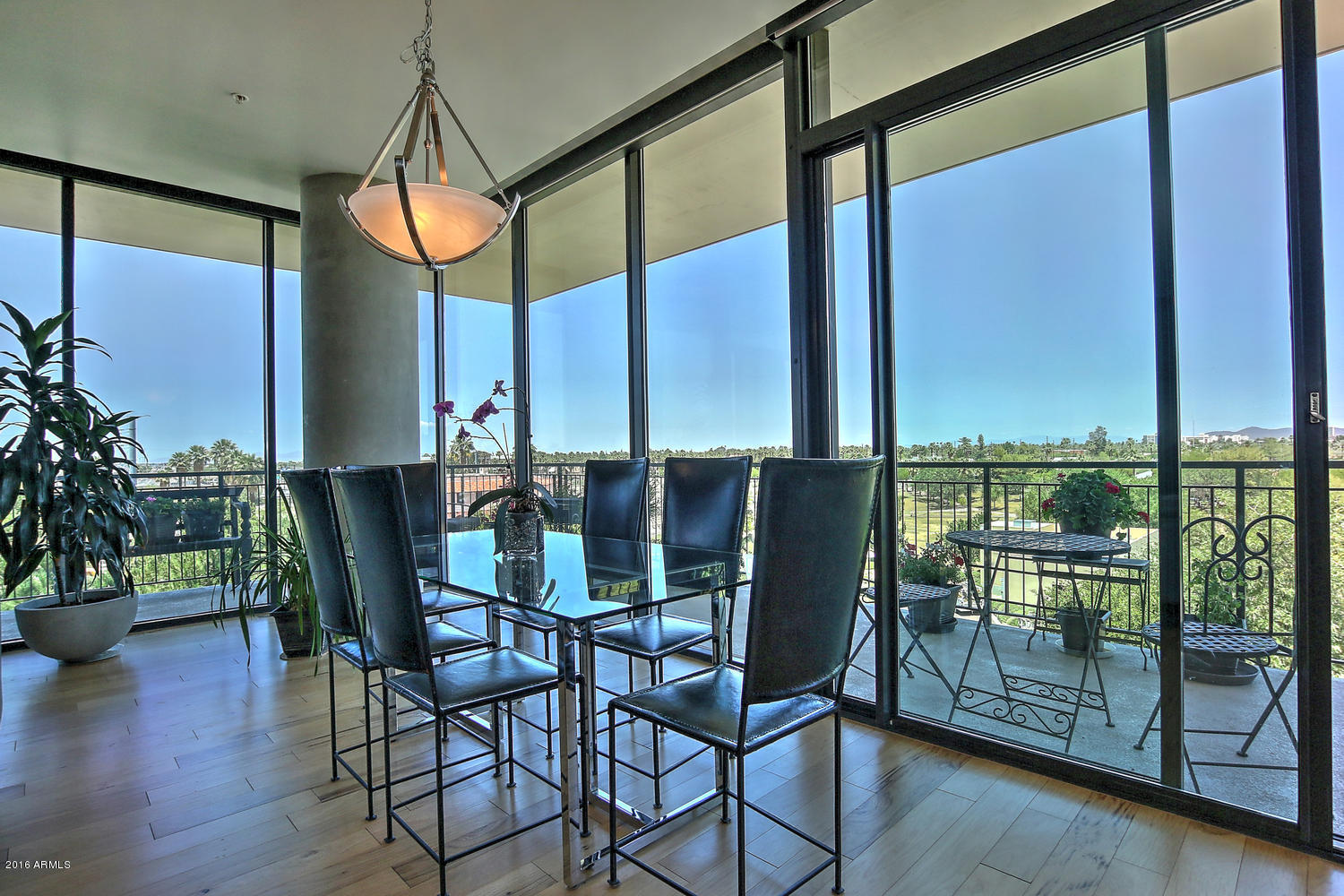 208 West Portland Street, Unit 460 Phoenix, AZ 85003 - Photo 10 of 37 a view of a dining room with furniture window and wooden floor