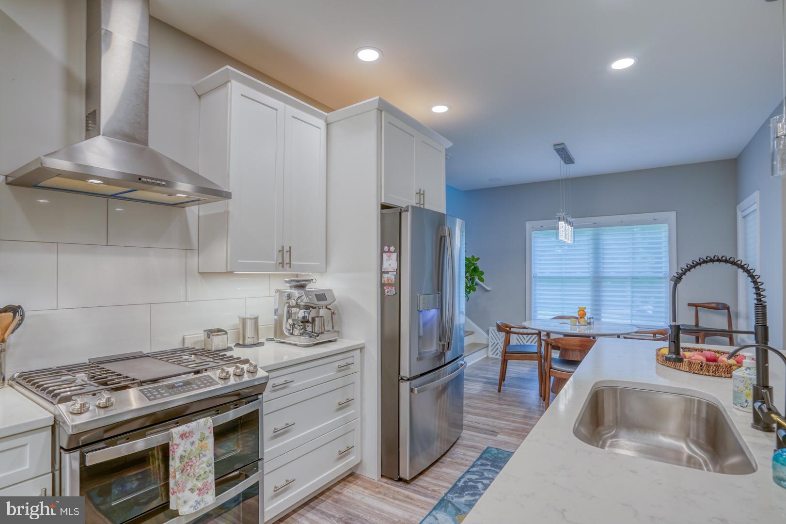 4 Rivers End Drive Seaford, DE 19973 - Photo 10 of 38 a kitchen with stainless steel appliances granite countertop a sink stove and refrigerator