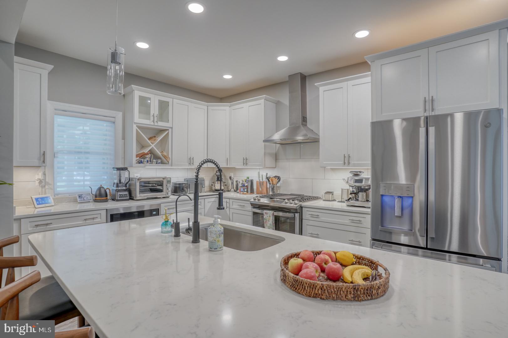 4 Rivers End Drive Seaford, DE 19973 - Photo 12 of 38 a kitchen with stainless steel appliances granite countertop a sink a stove and a refrigerator