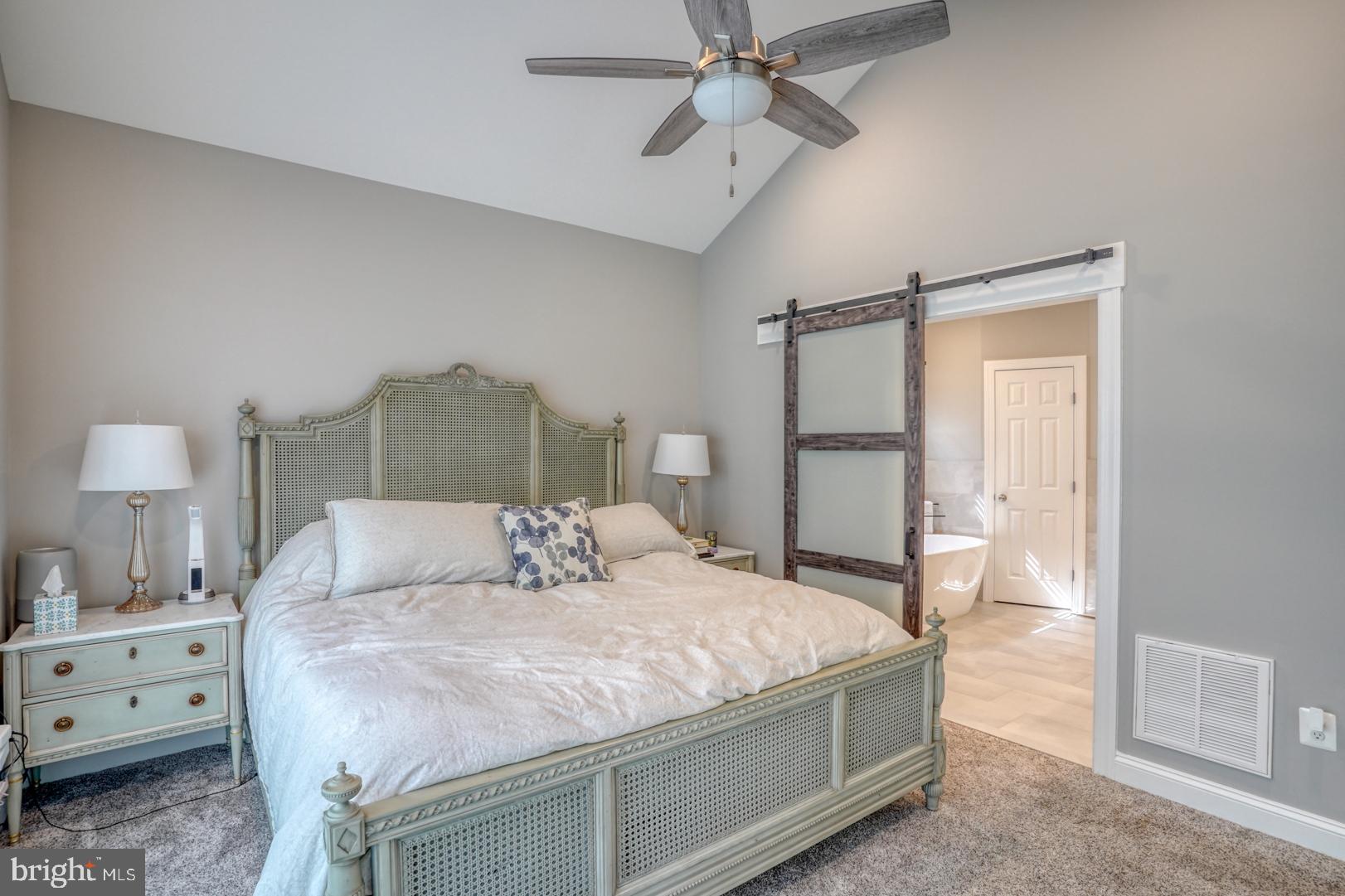 4 Rivers End Drive Seaford, DE 19973 - Photo 16 of 38 a bedroom with a bed and a chandelier