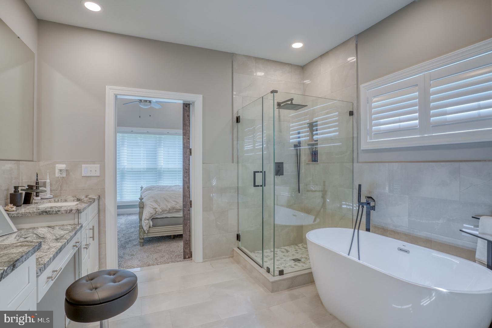 4 Rivers End Drive Seaford, DE 19973 - Photo 19 of 38 a bathroom with a tub a sink and glass door