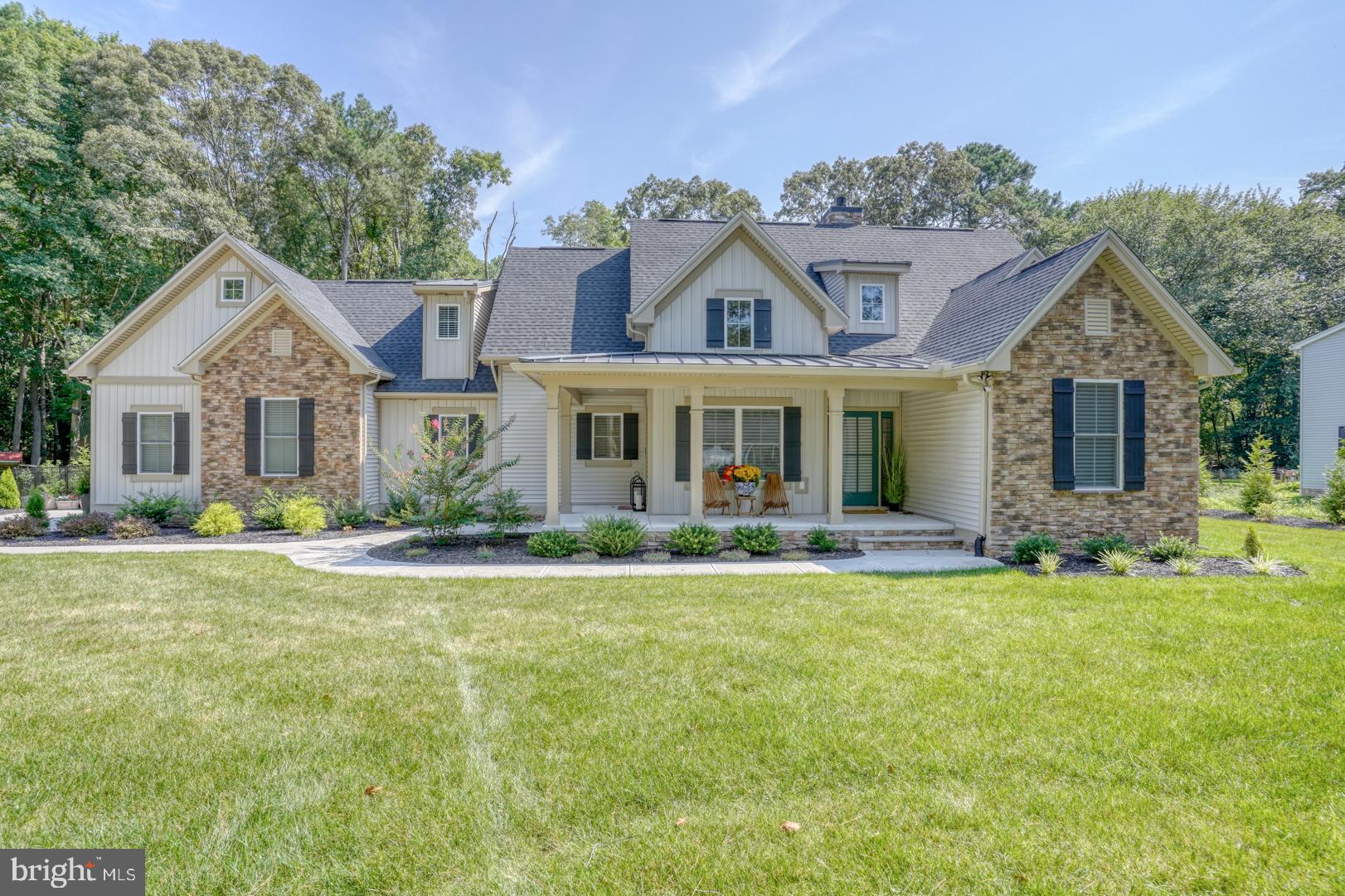 4 Rivers End Drive Seaford, DE 19973 - Photo 2 of 38 a front view of a house with a garden and yard
