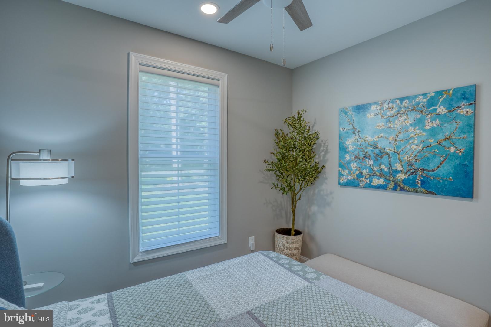 4 Rivers End Drive Seaford, DE 19973 - Photo 21 of 38 a bedroom with a bed and a potted plant