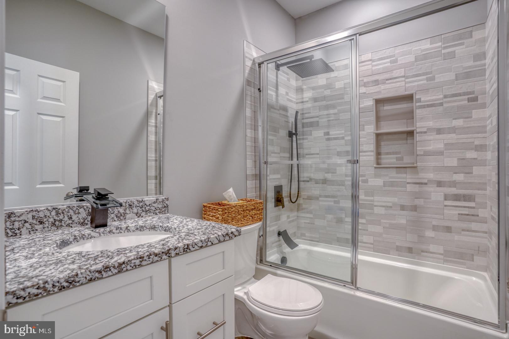 4 Rivers End Drive Seaford, DE 19973 - Photo 22 of 38 a bathroom with a granite countertop sink toilet and shower