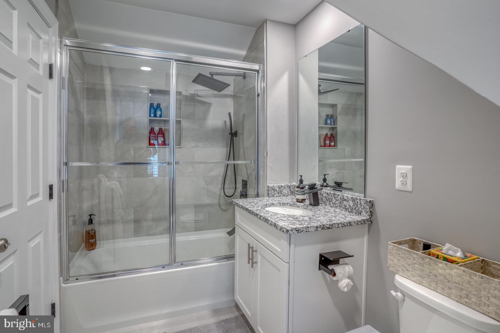 4 Rivers End Drive Seaford, DE 19973 - Photo 27 of 38 a bathroom with a granite countertop sink a mirror and shower