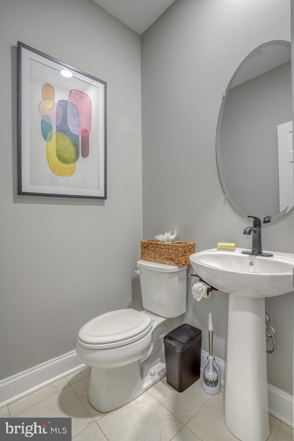 4 Rivers End Drive Seaford, DE 19973 - Photo 30 of 38 a bathroom with a toilet a sink and mirror