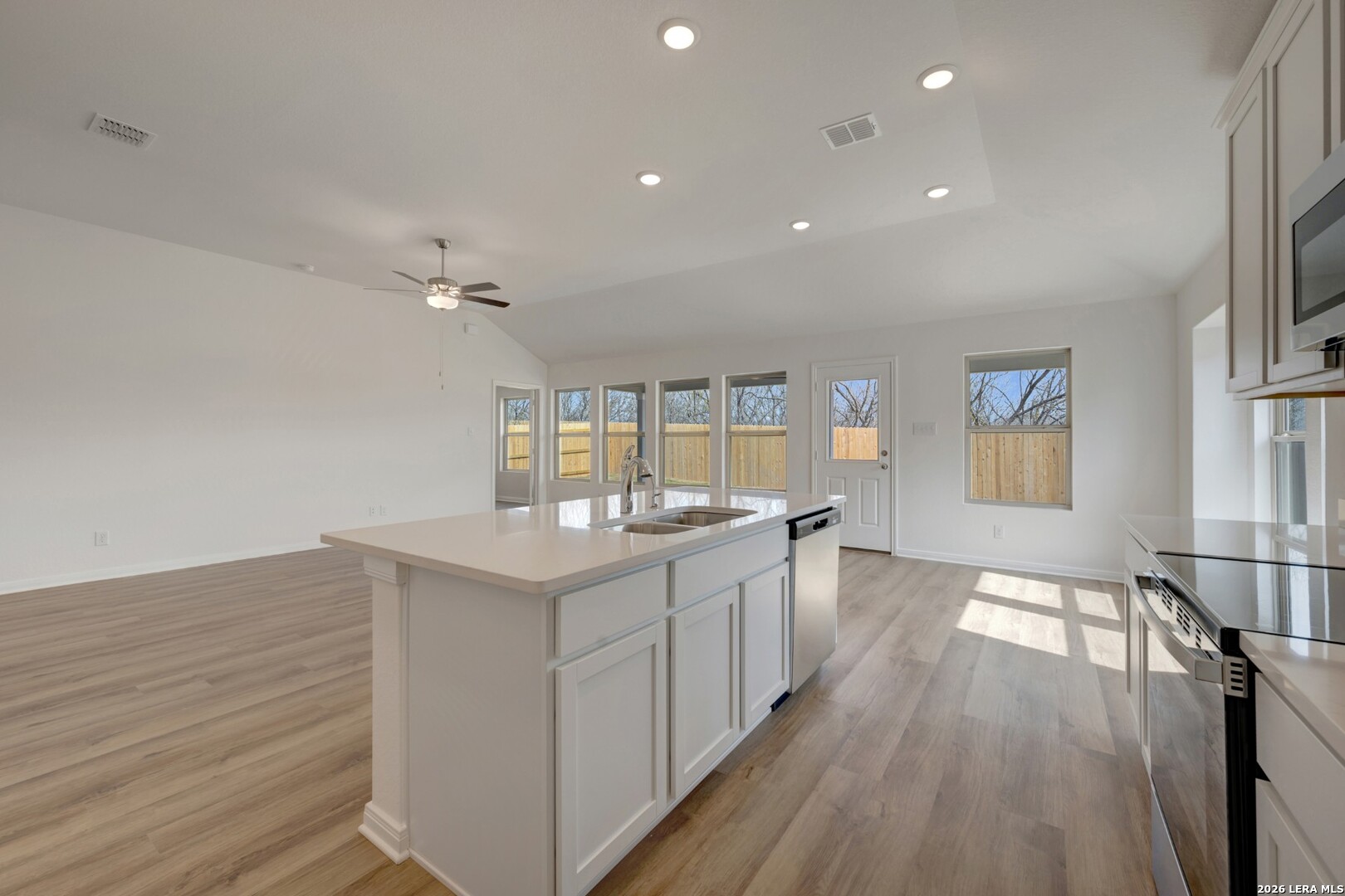 2829 Sun Bayou Seguin, TX 78155 - Photo 15 of 45 a kitchen with cabinets and wooden floor
