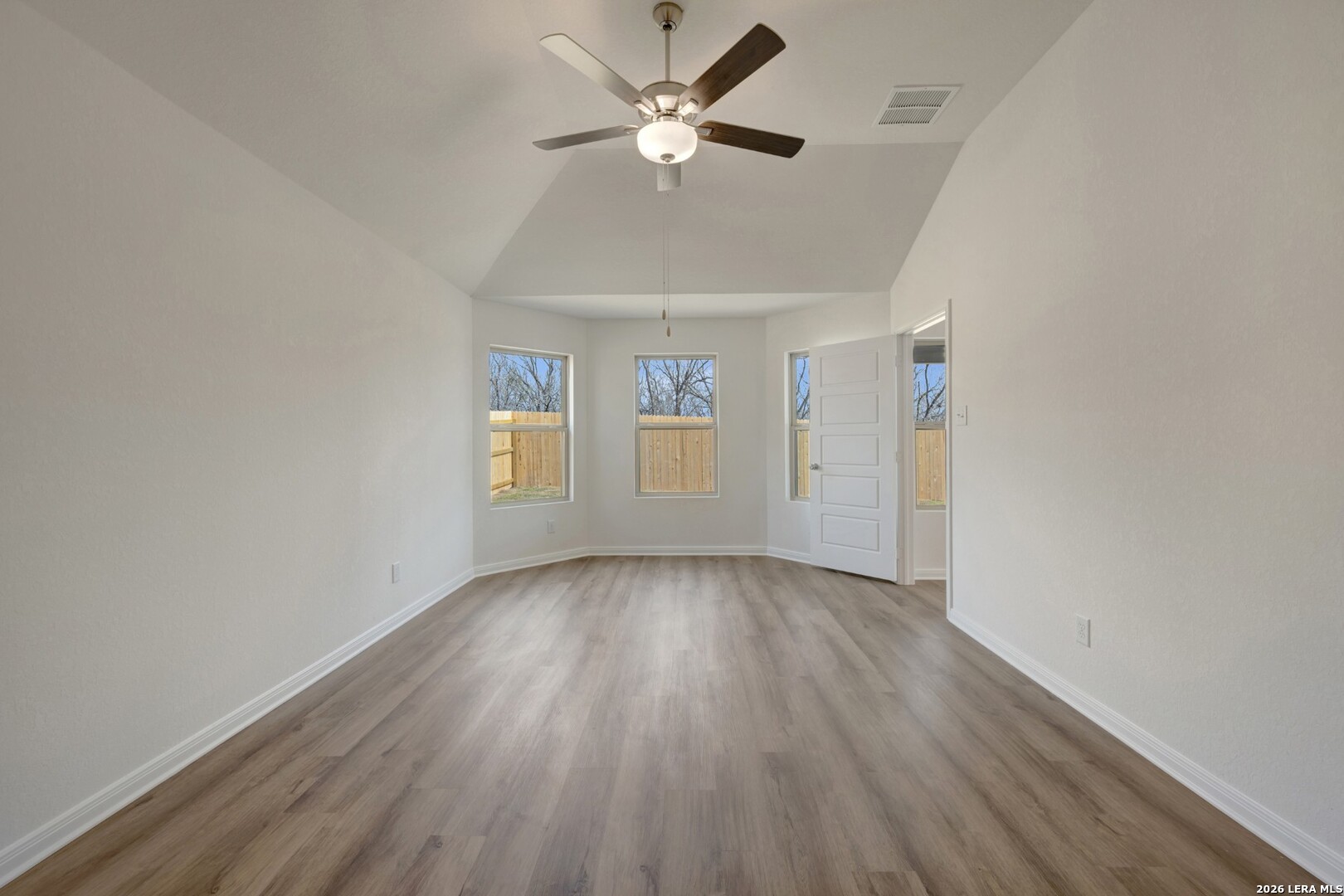 2829 Sun Bayou Seguin, TX 78155 - Photo 19 of 45 wooden floor in an empty room with a window