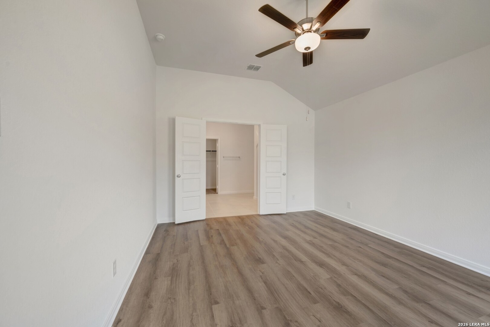 2829 Sun Bayou Seguin, TX 78155 - Photo 21 of 45 a view of a big room with wooden floor and a ceiling fan