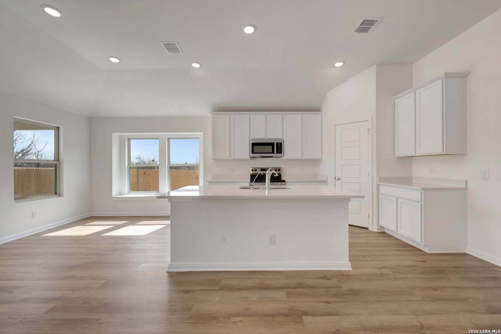 2829 Sun Bayou Seguin, TX 78155 - Photo 3 of 45 a view of kitchen with cabinets and wooden floor