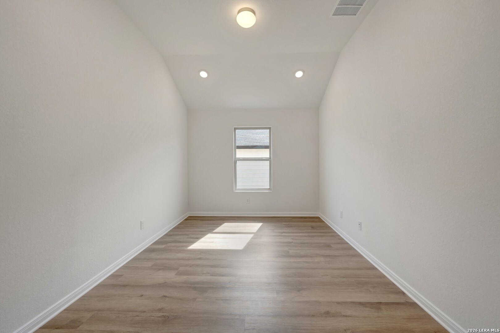 2829 Sun Bayou Seguin, TX 78155 - Photo 38 of 45 an empty room with wooden floor and windows