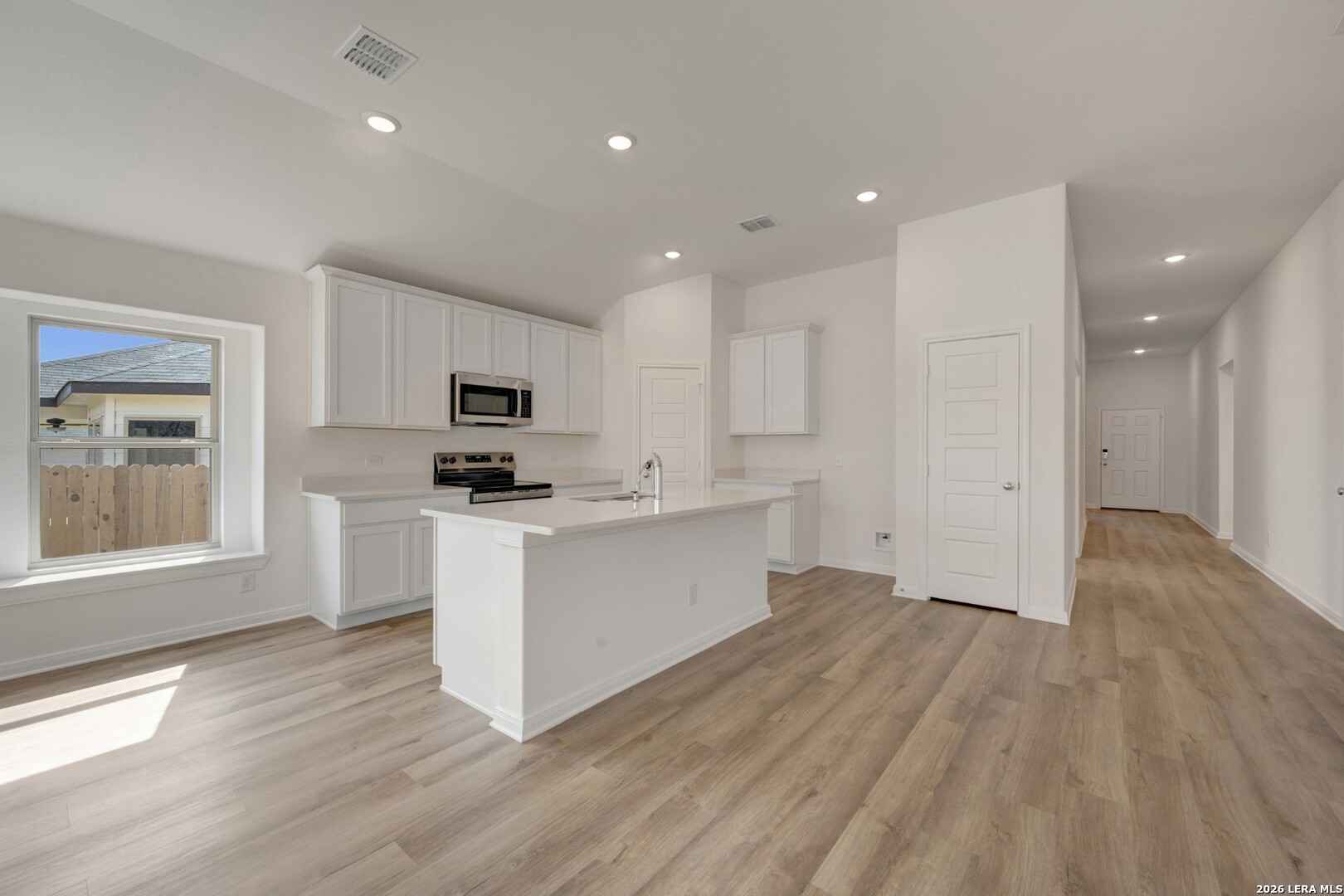 2829 Sun Bayou Seguin, TX 78155 - Photo 4 of 45 a view of kitchen with granite countertop cabinets and wooden floor