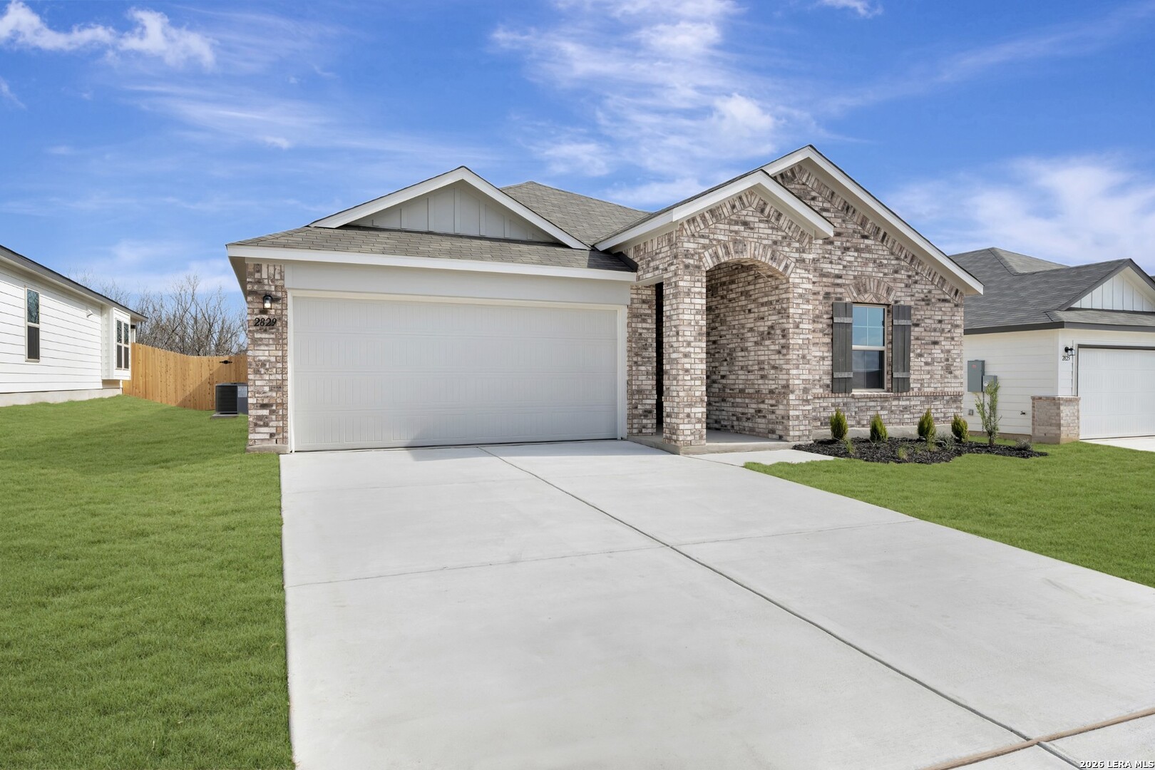 2829 Sun Bayou Seguin, TX 78155 - Photo 44 of 45 a front view of a house with a yard and garage