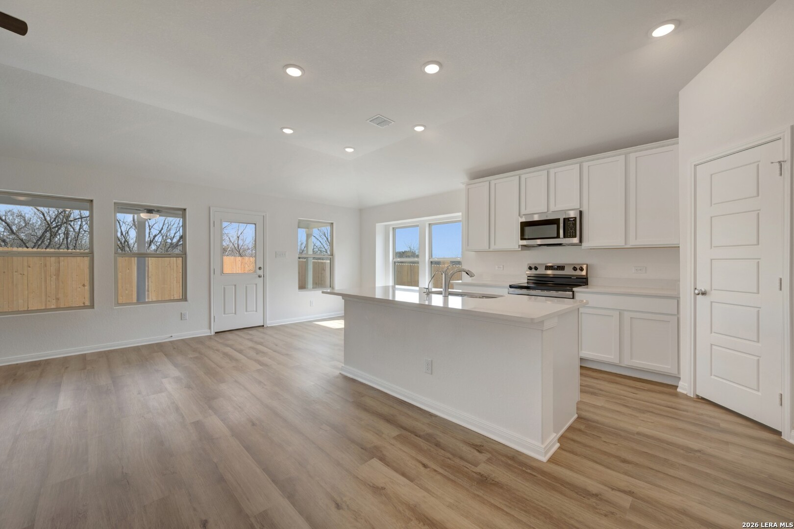 2829 Sun Bayou Seguin, TX 78155 - Photo 6 of 45 a kitchen with stainless steel appliances a refrigerator sink and microwave