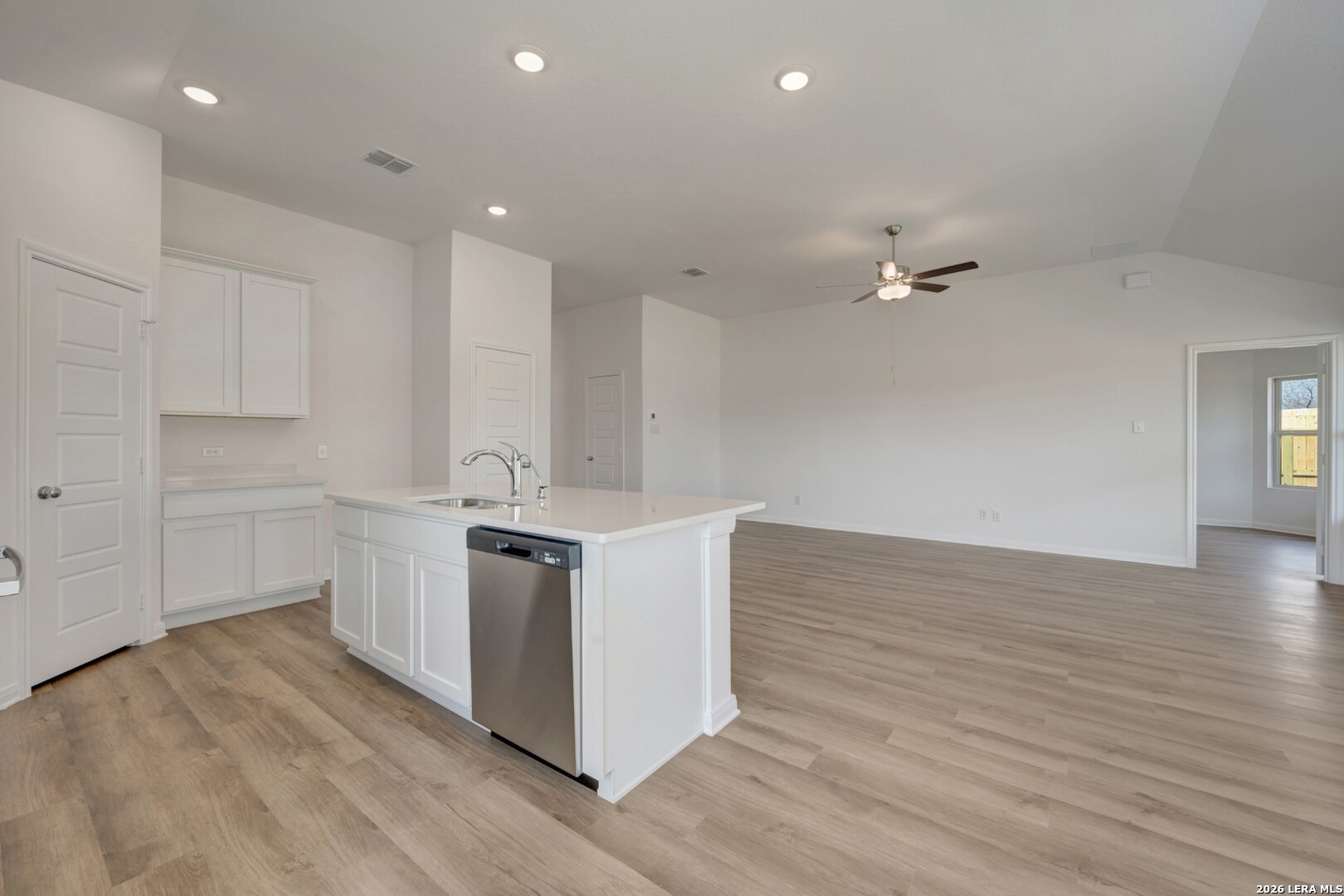2829 Sun Bayou Seguin, TX 78155 - Photo 7 of 45 a kitchen with stainless steel appliances granite countertop a sink stove and cabinets