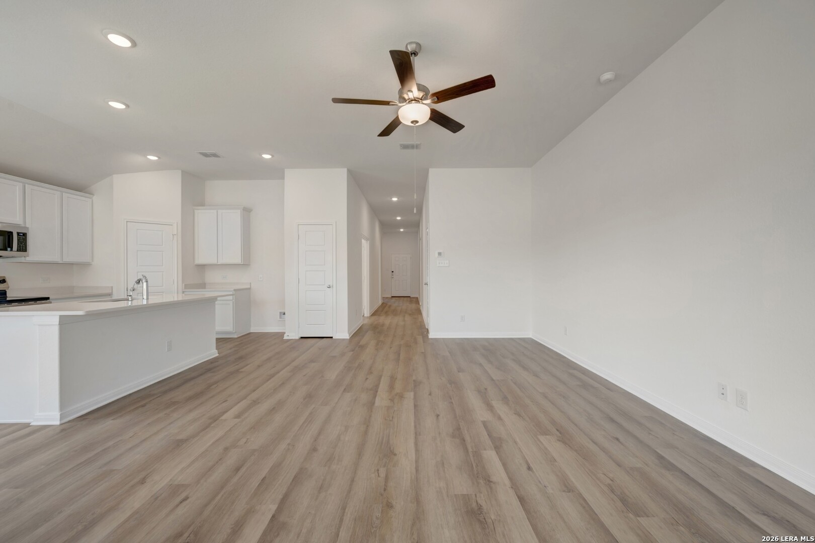 2829 Sun Bayou Seguin, TX 78155 - Photo 9 of 45 a view of kitchen with sink and wooden floor
