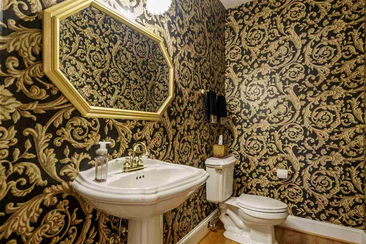 1028 Mersey Lane Raleigh, NC 27615 - Photo 12 of 30 Pedestal Sink, Custom Mirror & Hardwood Floors Powder Room / Half Bath