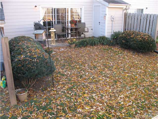 2406 Condor Court Raleigh, NC 27615 - Photo 15 of 16 a view of a patio with chairs and potted plants