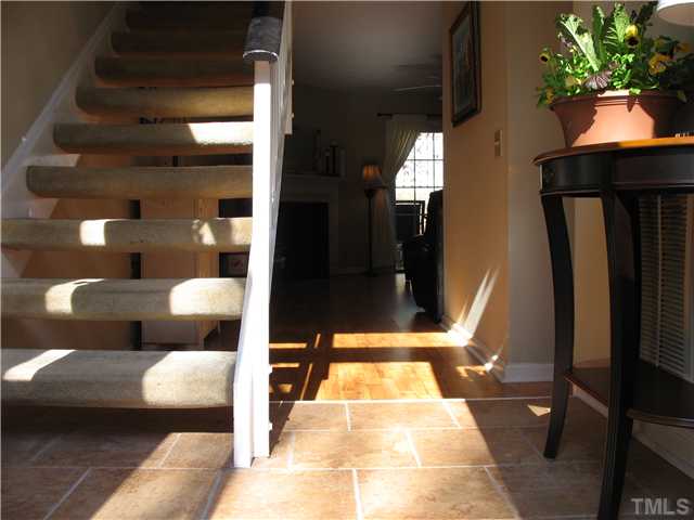 2406 Condor Court Raleigh, NC 27615 - Photo 2 of 16 a lobby with furniture and a potted plant