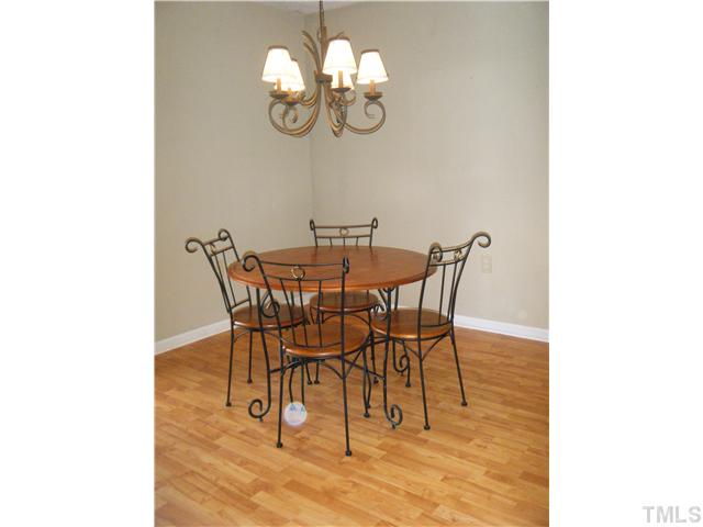 2406 Condor Court Raleigh, NC 27615 - Photo 5 of 16 a view of a dining room with furniture and a chandelier