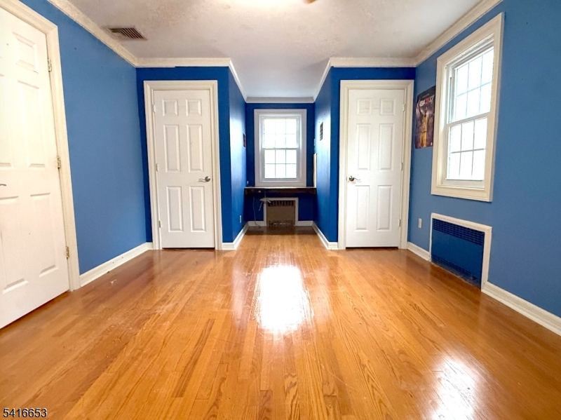 34 Howard Street Verona, NJ 07044 - Photo 16 of 20 an empty room with windows and closet