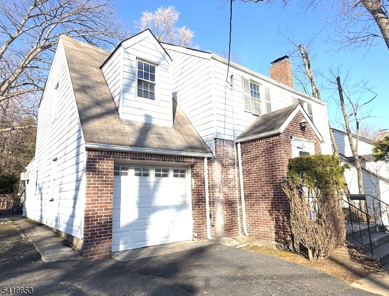 34 Howard Street Verona, NJ 07044 - Photo 2 of 20 a front view of a house