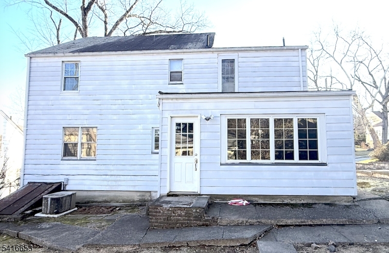 34 Howard Street Verona, NJ 07044 - Photo 3 of 20 a front view of a house with stairs