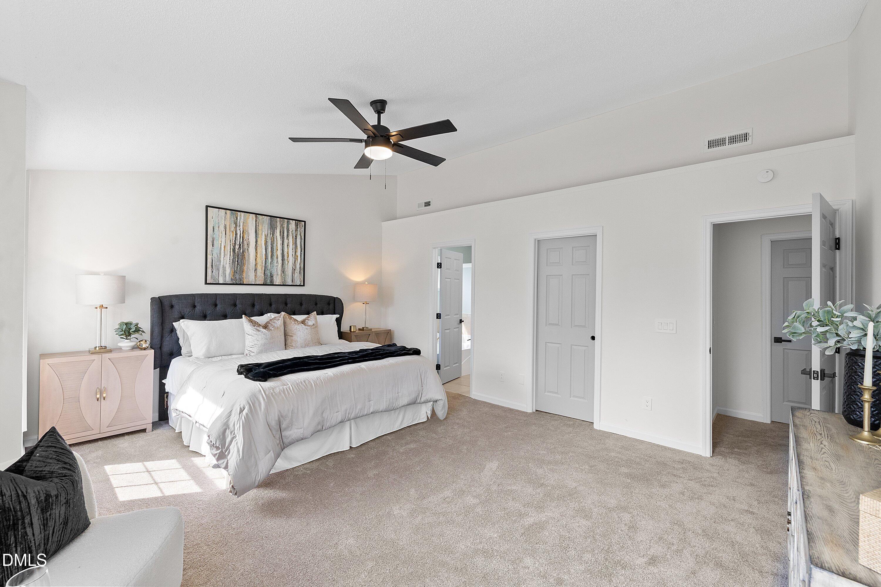 4219 Mantua Way Raleigh, NC 27604 - Photo 23 of 44 a bed room with a bed and a chandelier