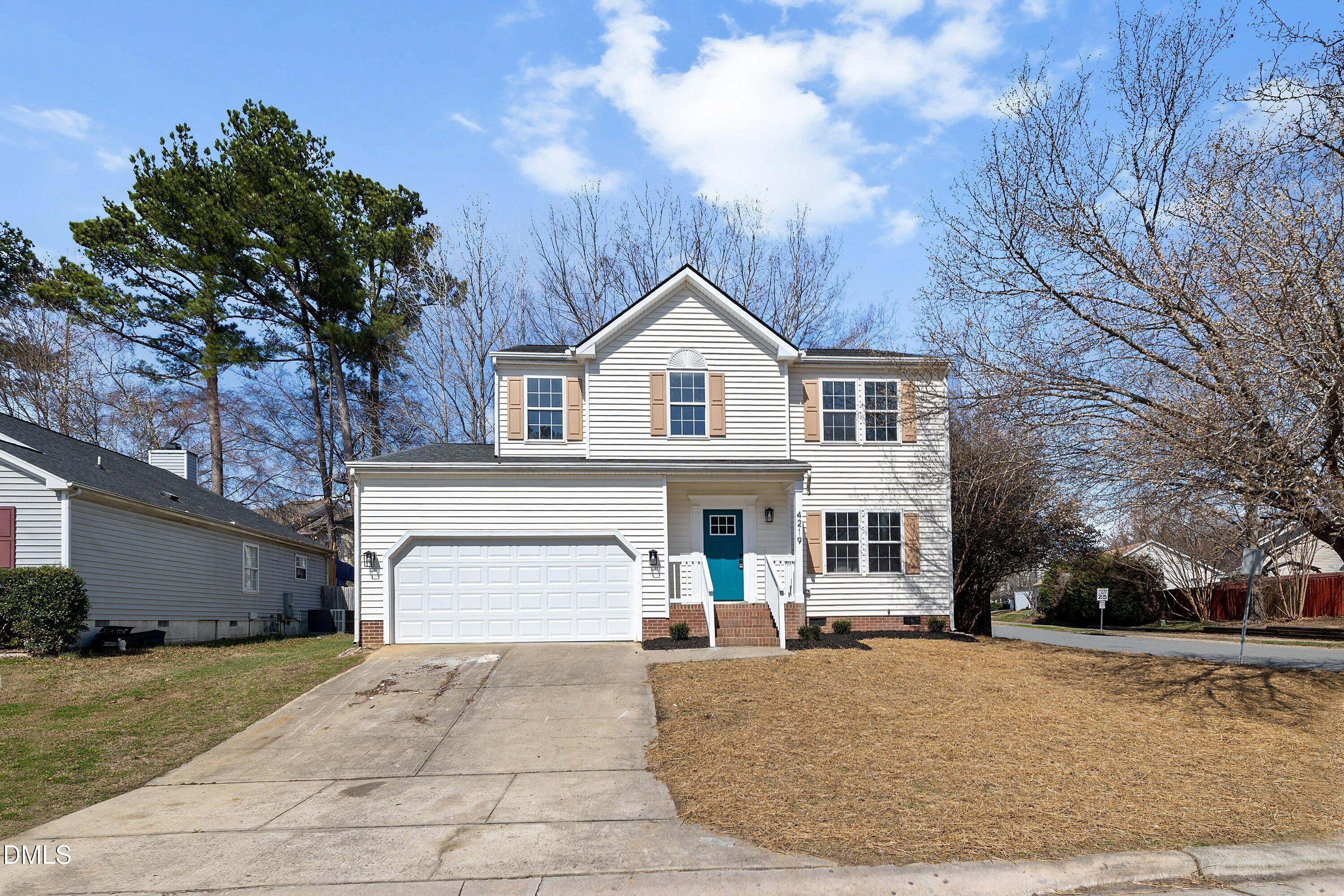 4219 Mantua Way Raleigh, NC 27604 - Photo 36 of 44 a front view of a house with a yard and garage