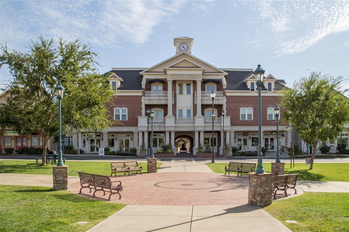 4314 Edgewater Court Copperopolis, CA 95228 - Photo 12 of 13 a view of a building with a swimming pool and a yard