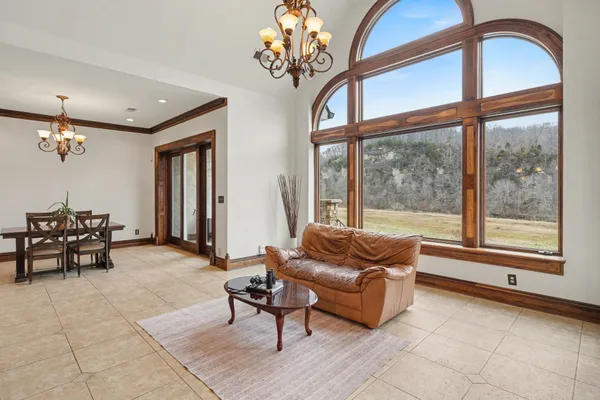 a bedroom with a large bed and a large window